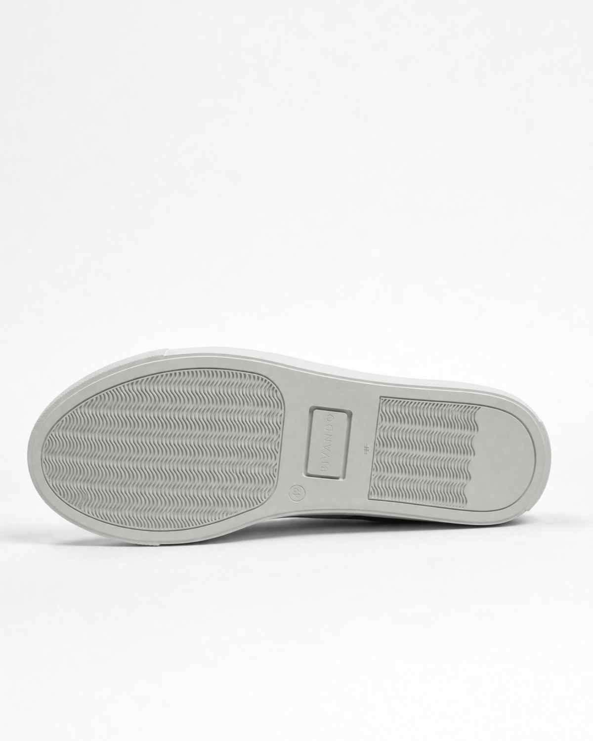 Rubber outsole of the Bivando Midnight Camo Sneaker, with tread pattern and embossed Bivando logo